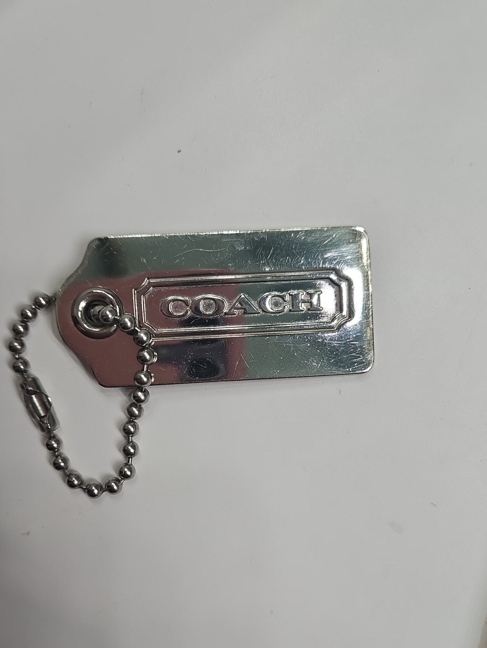 COACH Silver Logo Hangtag